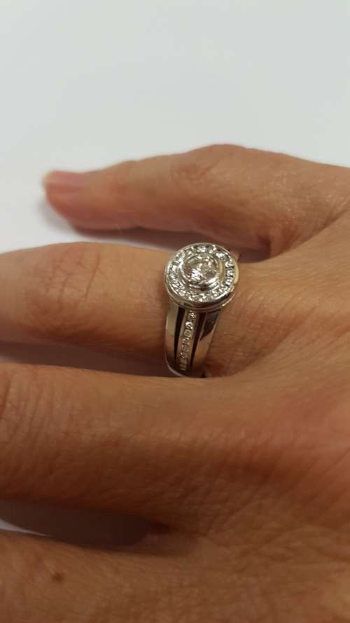 18ct White gold diamond halo ring c/w channel set diamonds on the sides