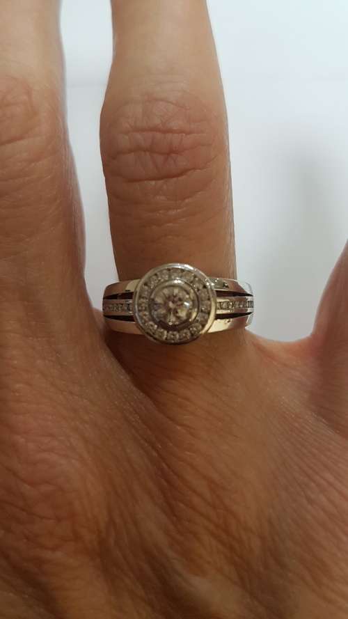 18ct White gold diamond halo ring c/w channel set diamonds on the sides