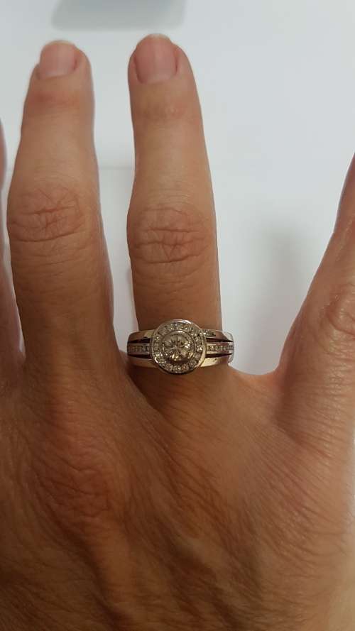 18ct White gold diamond halo ring c/w channel set diamonds on the sides