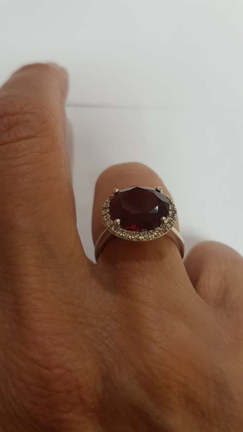 Garnet and diamond dress ring set in 9ct white gold