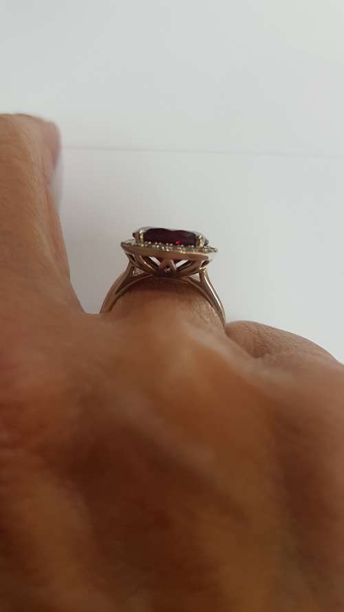 Garnet and diamond dress ring set in 9ct white gold