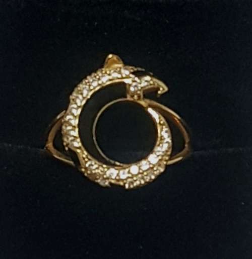 A diamond/black enamel and gold ring copy from the Cartier Jaguar Collection