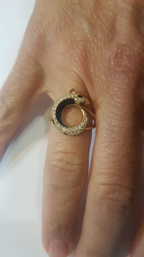 A diamond/black enamel and gold ring copy from the Cartier Jaguar Collection