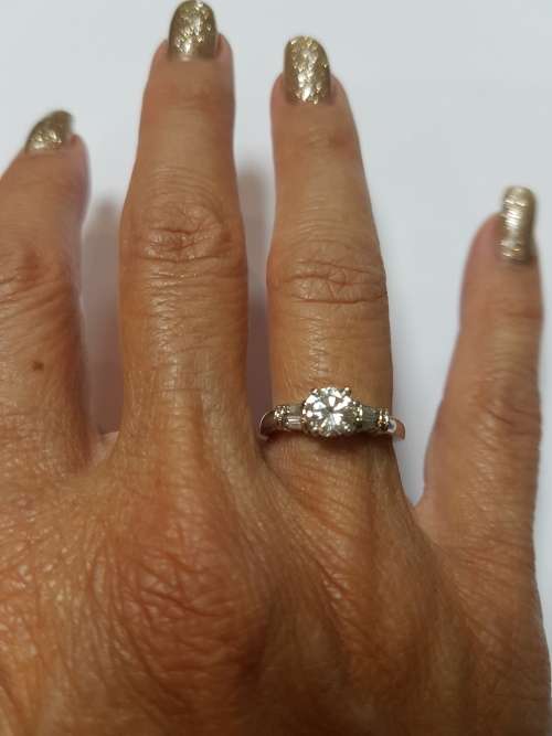 Platinum (10 grams) diamond engagement ring c/w 1/2 eternity band to match and valuation cert