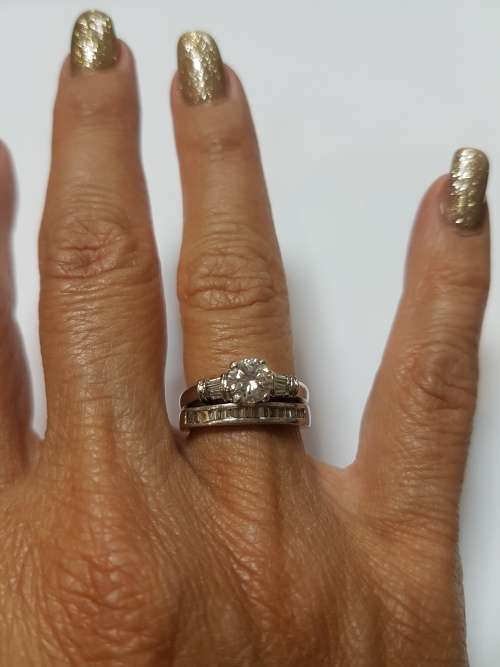 Platinum (10 grams) diamond engagement ring c/w 1/2 eternity band to match and valuation cert