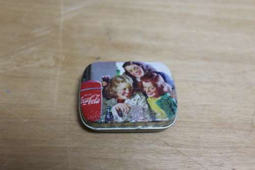 Collectible Coca-Cola memorabilia - small vintage container