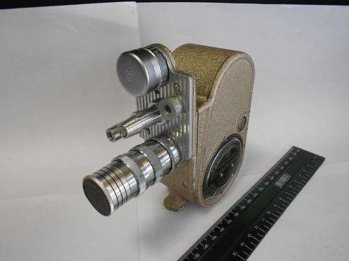 G.B-Bell and Howell model 605 movie camera with film and leather pouch - as per scan