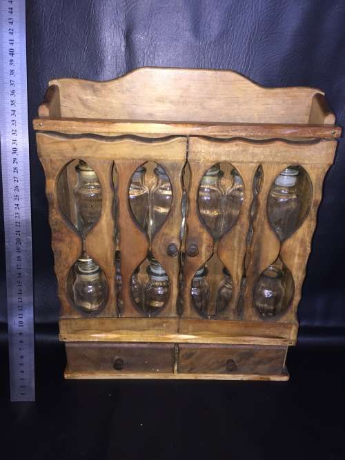 Beautiful wooden spice rack with 12 glass bottles 2 bottles are missing the lids