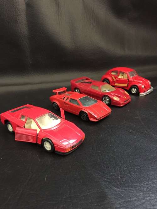3 metal cars and 1 hard plastic Ferrari bid for all!!!!