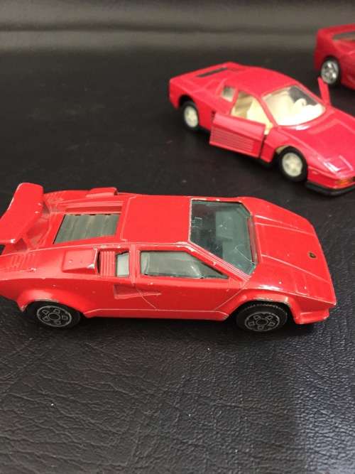 3 metal cars and 1 hard plastic Ferrari bid for all!!!!