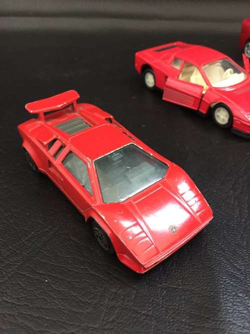 3 metal cars and 1 hard plastic Ferrari bid for all!!!!