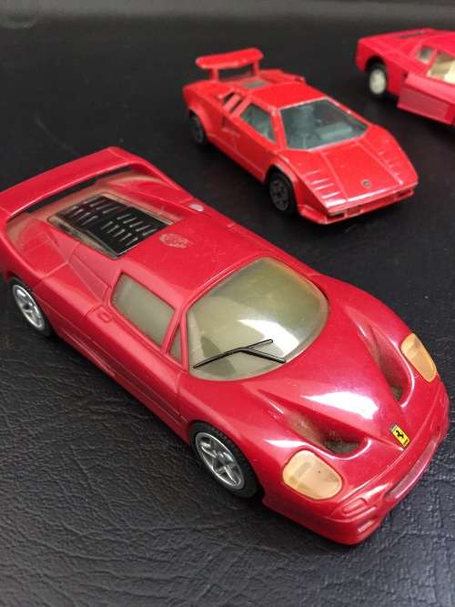 3 metal cars and 1 hard plastic Ferrari bid for all!!!!
