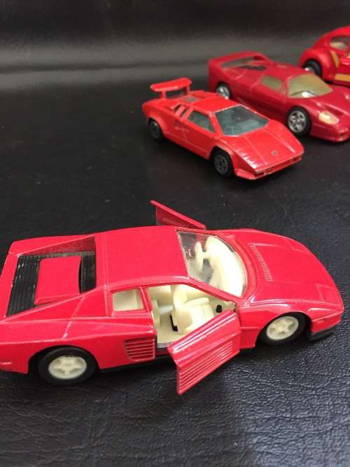 3 metal cars and 1 hard plastic Ferrari bid for all!!!!