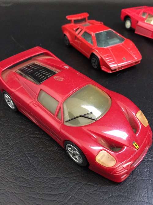 3 metal cars and 1 hard plastic Ferrari bid for all!!!!