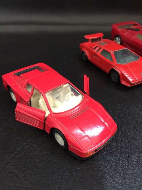 3 metal cars and 1 hard plastic Ferrari bid for all!!!!