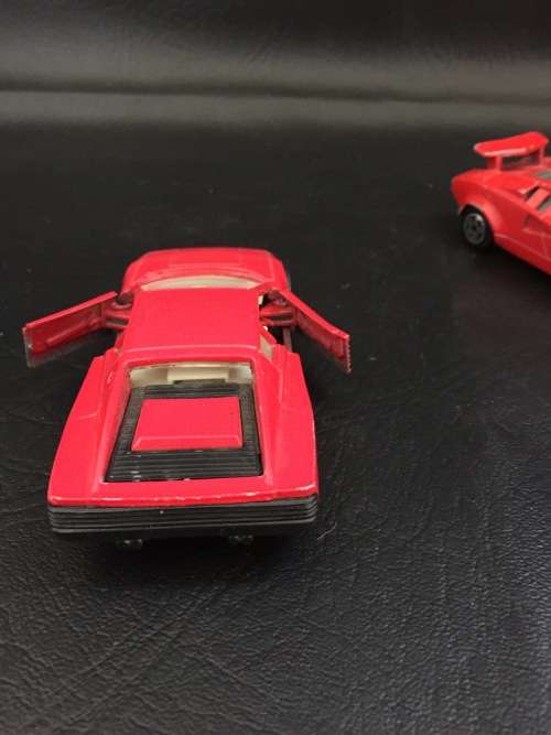 3 metal cars and 1 hard plastic Ferrari bid for all!!!!