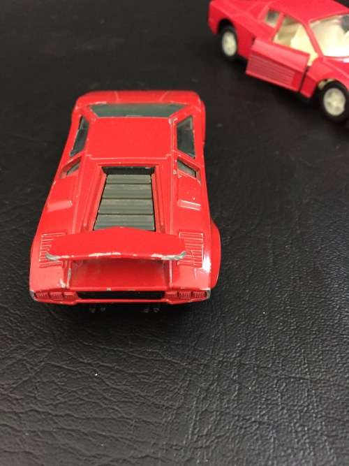 3 metal cars and 1 hard plastic Ferrari bid for all!!!!