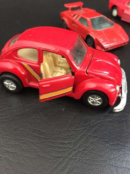 3 metal cars and 1 hard plastic Ferrari bid for all!!!!