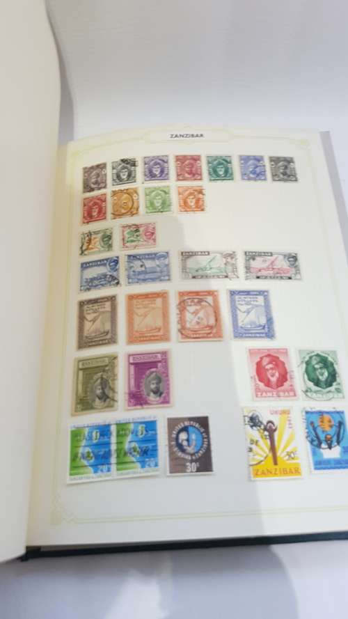 Large Stanley Gibbons stamp album full of stamps from all over the world!!!!!