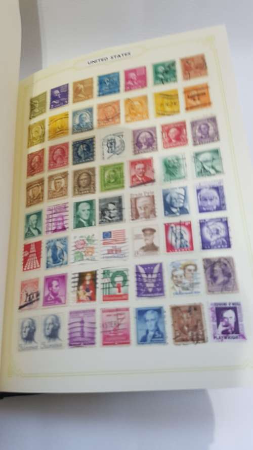 Large Stanley Gibbons stamp album full of stamps from all over the world!!!!!