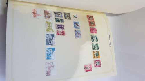 Large Stanley Gibbons stamp album full of stamps from all over the world!!!!!