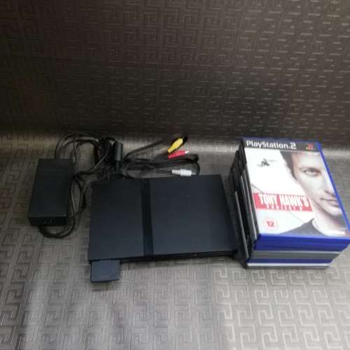 Vintage ps2 with 7 games ps2 goes on but does not read disks!!!!!