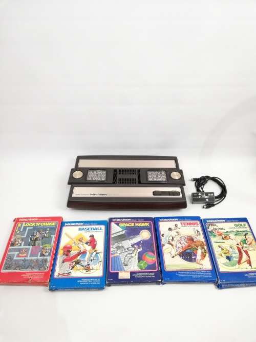 Rare intelivision console with boxed games working 100% compete!!!!