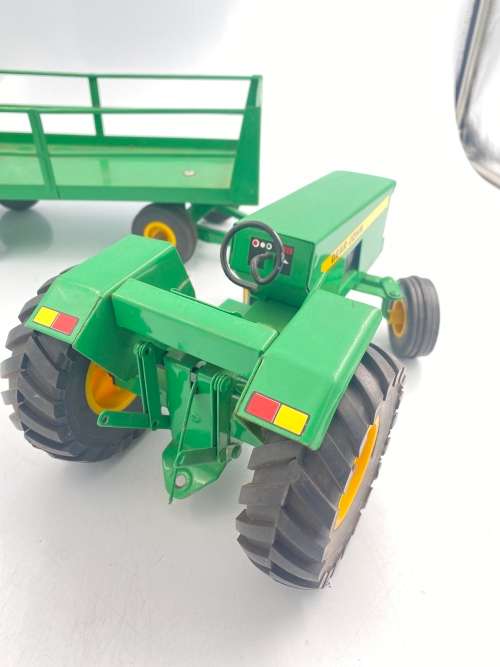 MASSIVE JOHN DEER TRACTOR AND TRAILER BID FOR BOTH IN GREAT CONDITION!!!!