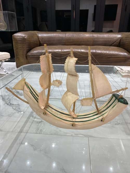 VINTAGE SAILING SHIP MADE FROM A CARVED WARTHOG TUSK, INLAID WITH MALACHITE!!!
