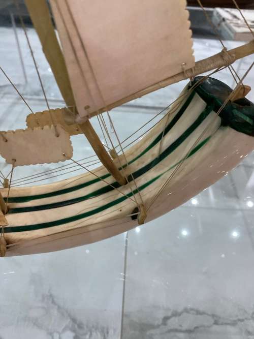 VINTAGE SAILING SHIP MADE FROM A CARVED WARTHOG TUSK, INLAID WITH MALACHITE!!!