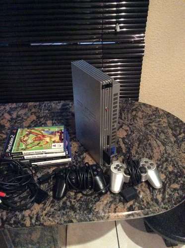 Older PS2 silver with 84 games