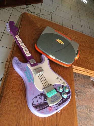 Hannah Montana guitar + small laptop computer for education.