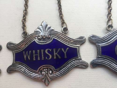 VINTAGE WHISKY, BRANDY and GIN DECANTER , ENAMELED BRASS NECK TAGS