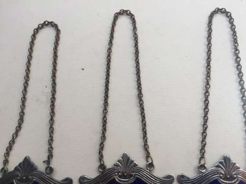 VINTAGE WHISKY, BRANDY and GIN DECANTER , ENAMELED BRASS NECK TAGS