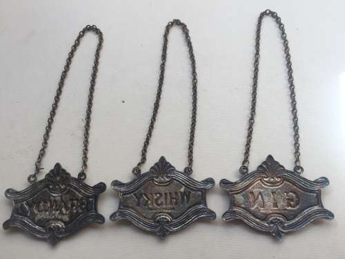 VINTAGE WHISKY, BRANDY and GIN DECANTER , ENAMELED BRASS NECK TAGS