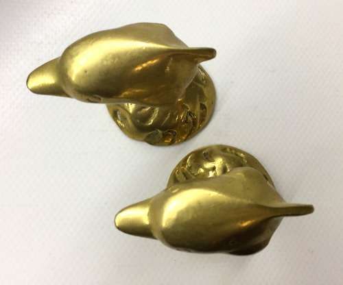 A  MATCHED PAIR  OF SOLID BRASS, DOLPHIN  ORNAMENTS