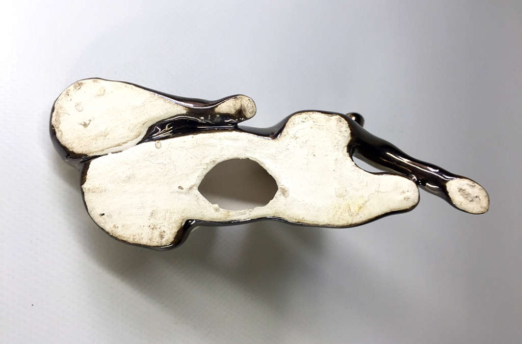 METALLIC -GLAZED  , PORCELAIN RECLINING HORSE FIGURINE