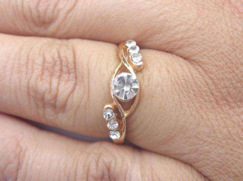 Golden Ring with Zirconia and six Diamonds
