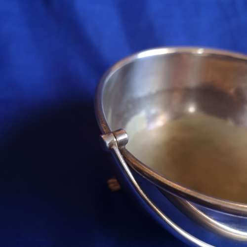 Silver plated bowl with 3 shell legs and handle
