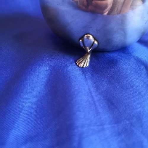 Silver plated bowl with 3 shell legs and handle