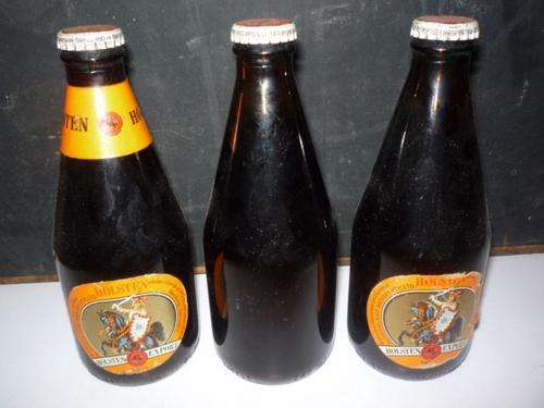 THREE BOTTLES OF HOLSTEIN BEER - ONE HAS NO LABEL