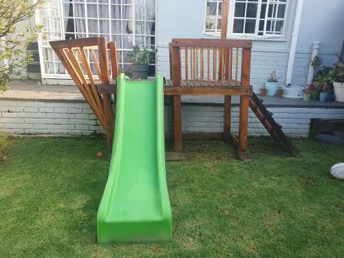 Wooden jungle gym with slide