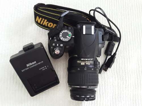 Nikon D3100, 8GB card, charger, cable, bag and tripod in bag