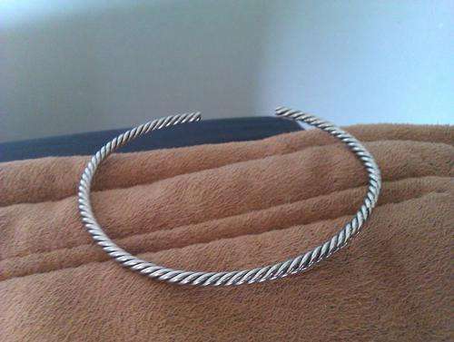 Stainless steel twisted open bangle.