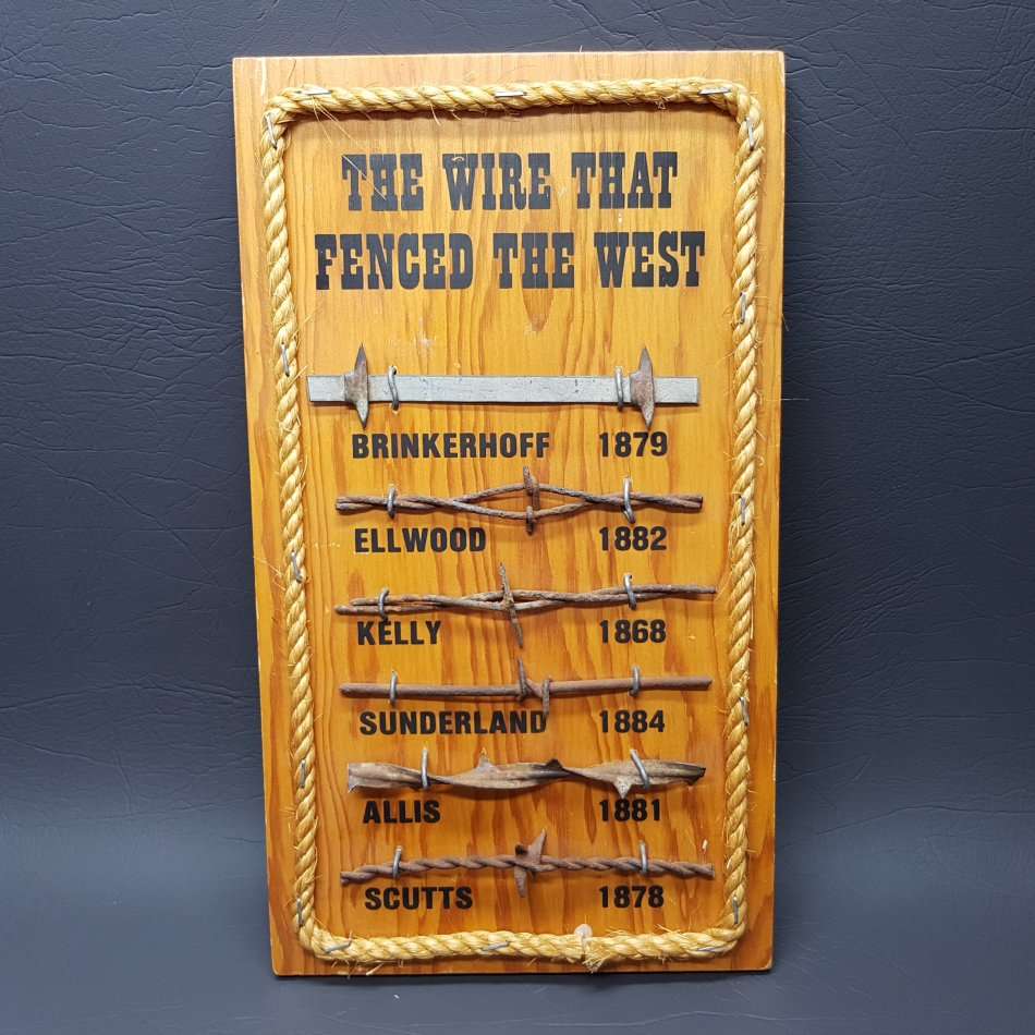 Metal on wood "The Wire that Fenced the West"