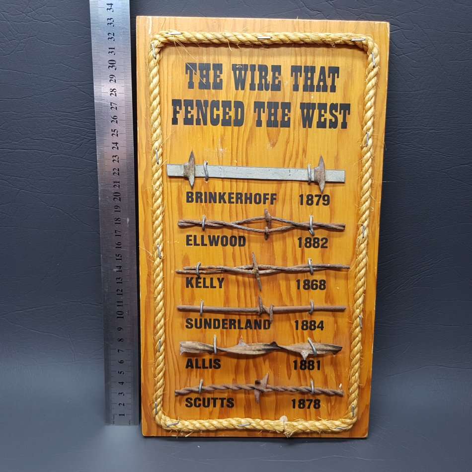 Metal on wood "The Wire that Fenced the West"