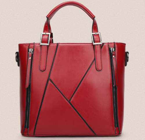 Elegant and beautiful ladies handbag with strape. Dark red color. Stock in ZA