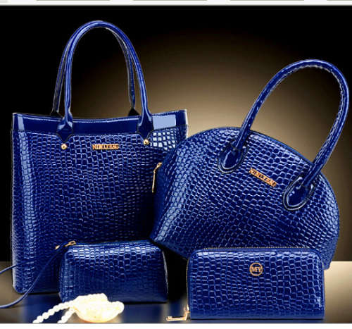 4 Pieces set handbags. Crocodile pattern, 2 handbags, 1 cosmetic, 1 purse. Blue color. Stock in ZA
