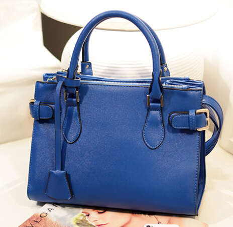 Office lady loves wild match handbag. Blue color. Stock in ZA