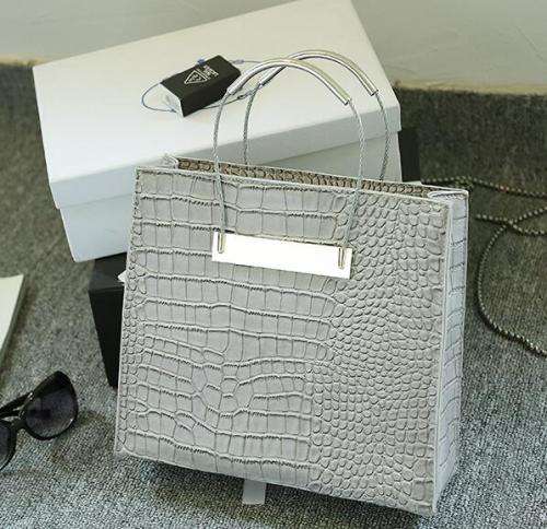 Crocodile pattern stereotyped fashion steel handle handbag.Grey color